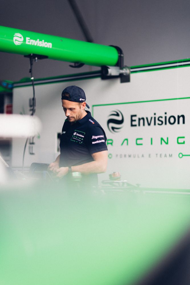 An Envision Racing mechanic prepares a car ahead of the São Paulo ePrix.
