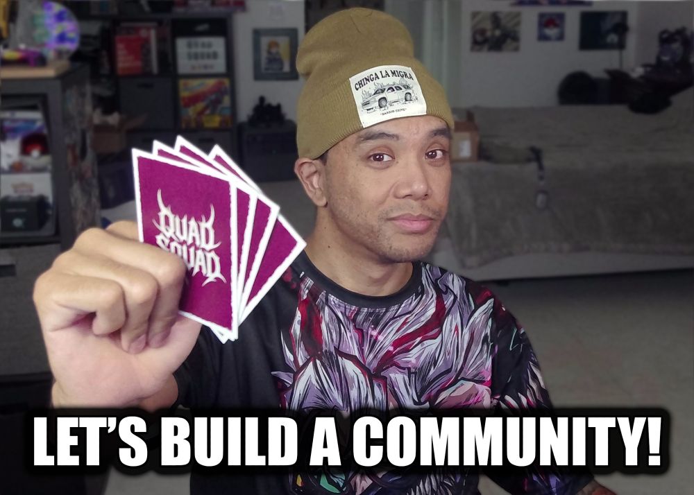 mike holding a few cards grinning at the camera. text line says 'let's build a community'