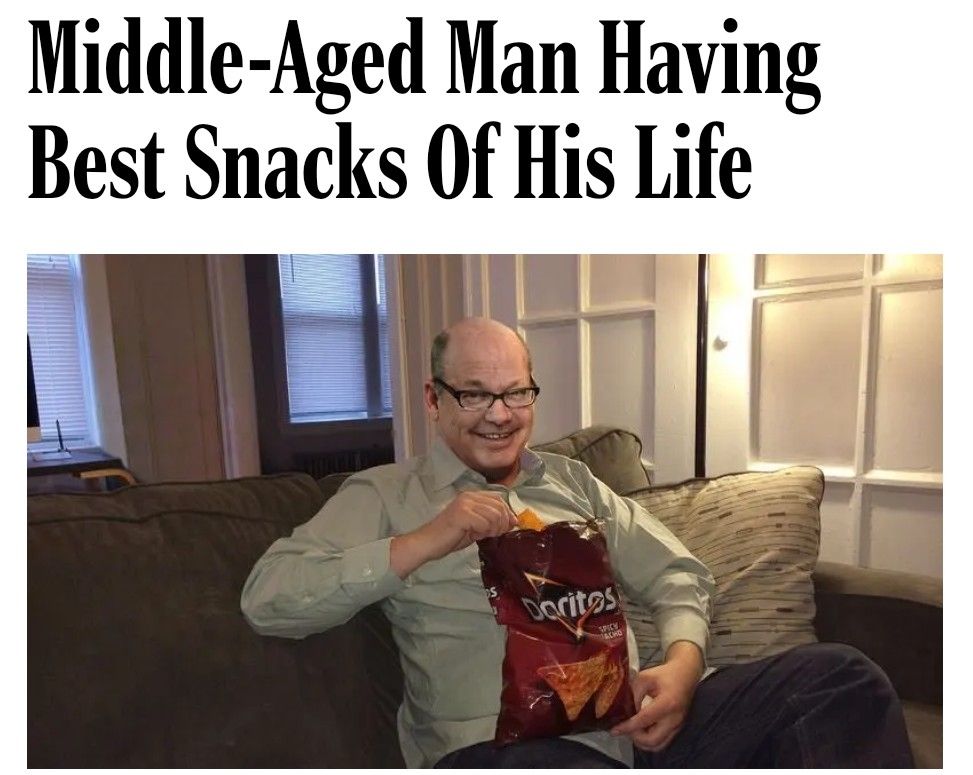 Middle-Aged Man Having Best Snacks Of His Life