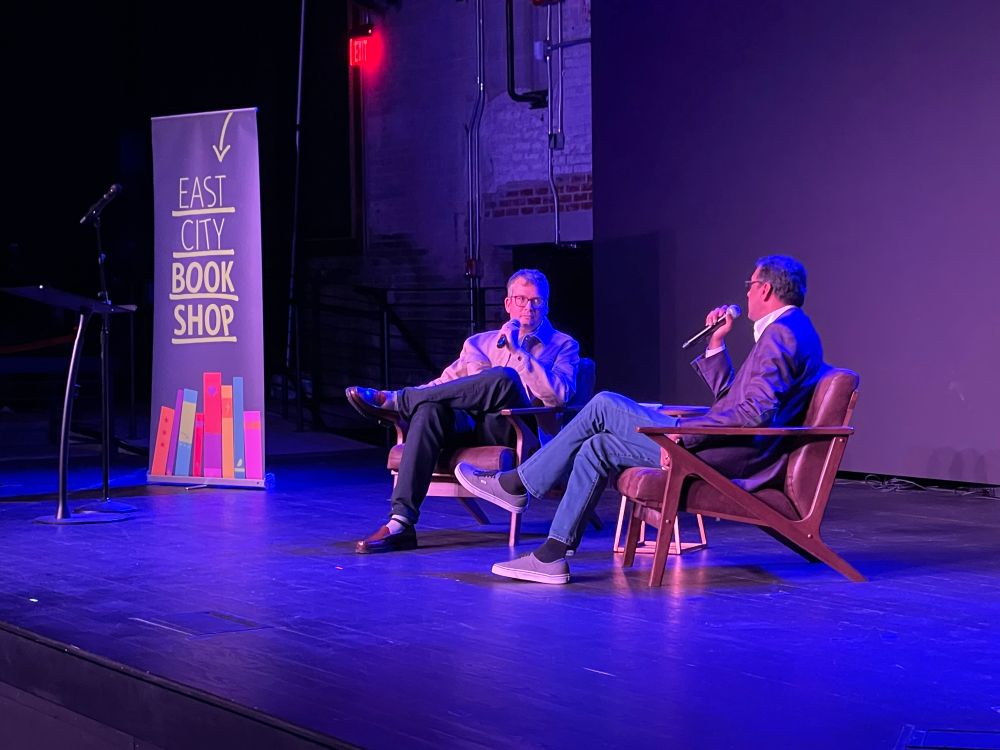 Photo of John Green in conversation with Atul Gawande.
