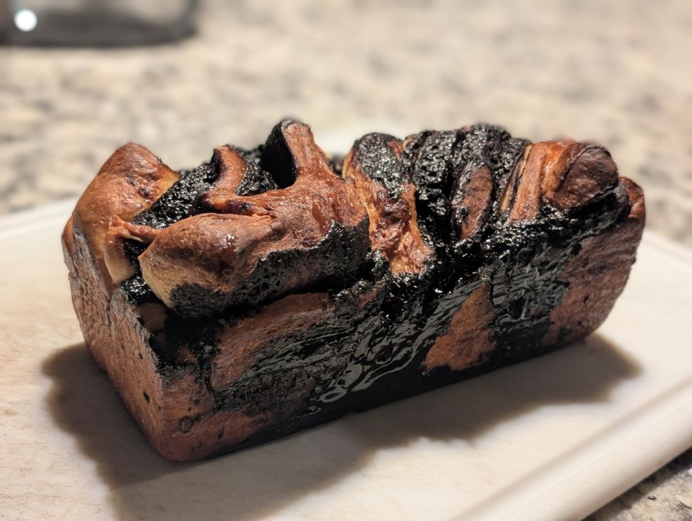 Loaf of chocolate babka on a cutting board 