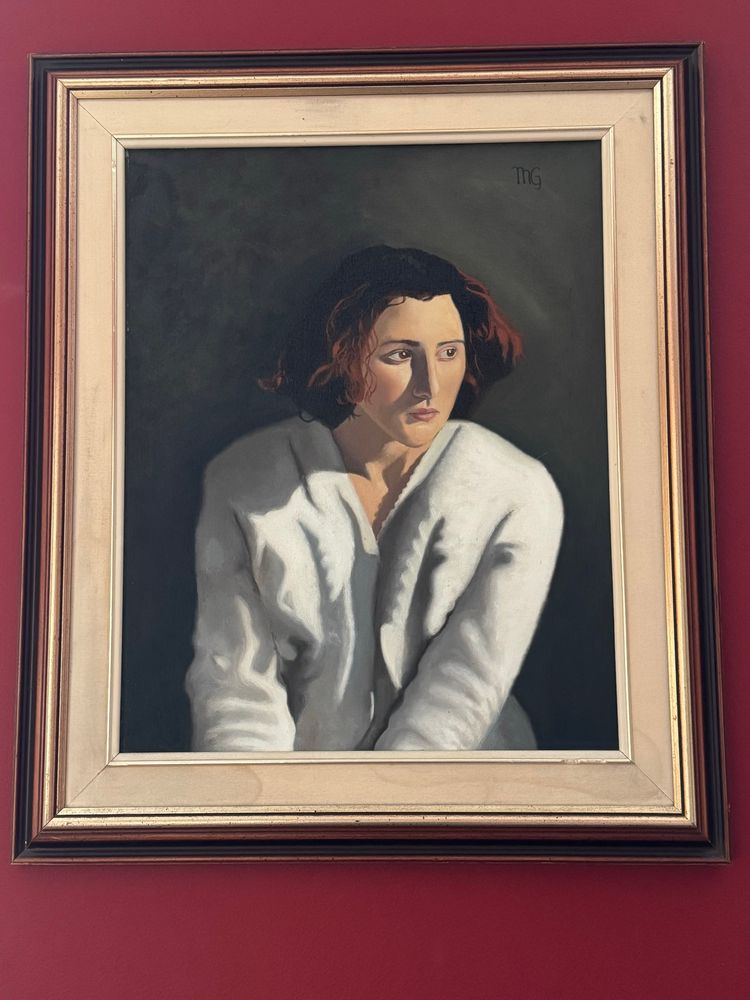 A self-portrait of a very earnest looking 17-year-old girl wearing a white sweater