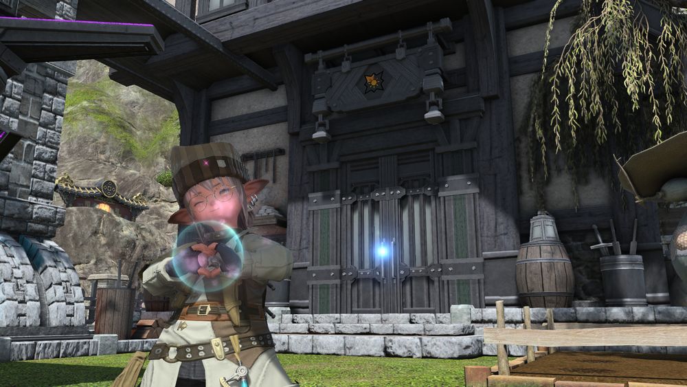 a dunesfolk sage standing in front of a small free company estate in shirogane making a heart with his tiny little popoto hands