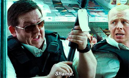 Danny Butterman from Hot Fuzz gleefully loads a gun while saying “shame”