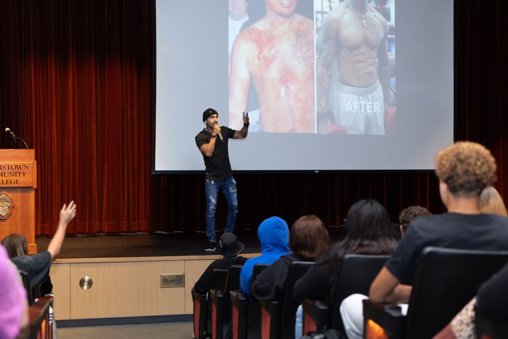Fausto speaking on stage