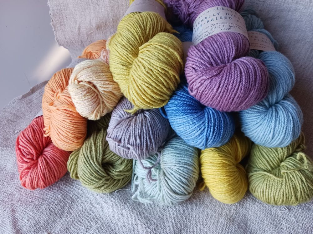 Multicolored skeins of naturally dyed wool.