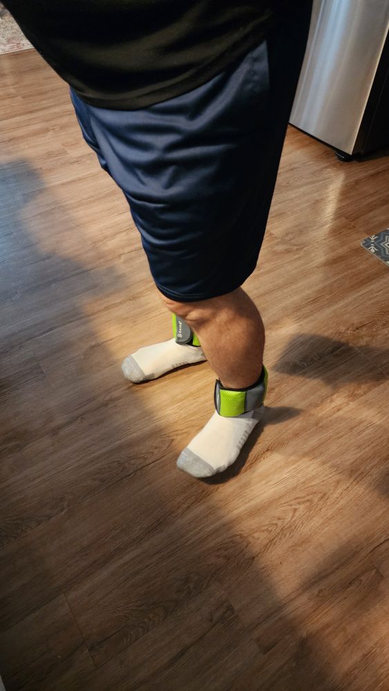 Picture of husband wearing bright green high-vis weights