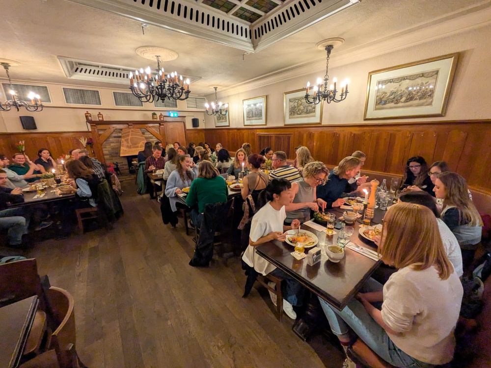 Early Career Researchers' dinner, around 40 ECRs sat down across 5 tables, eating their dinner in a German restaurant