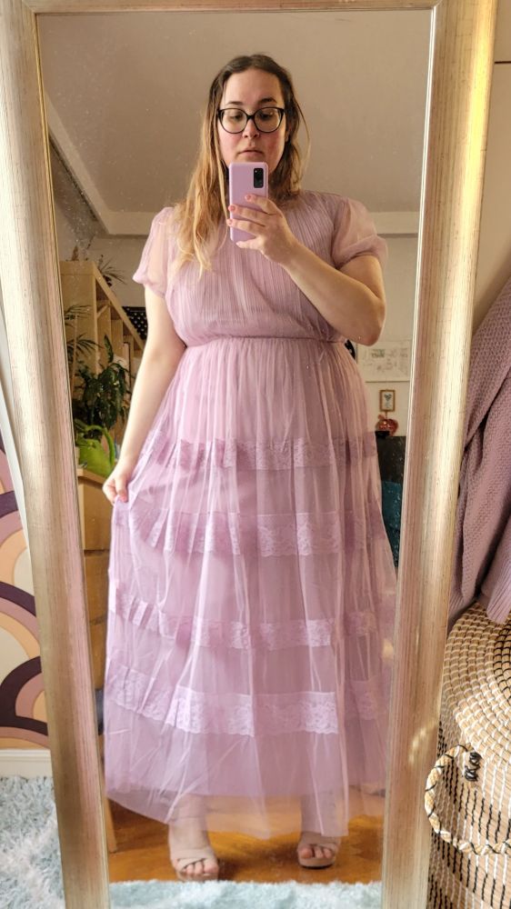 mirrorselfie from 2022, wearing a long violet dress and still having long blonde-brown hair