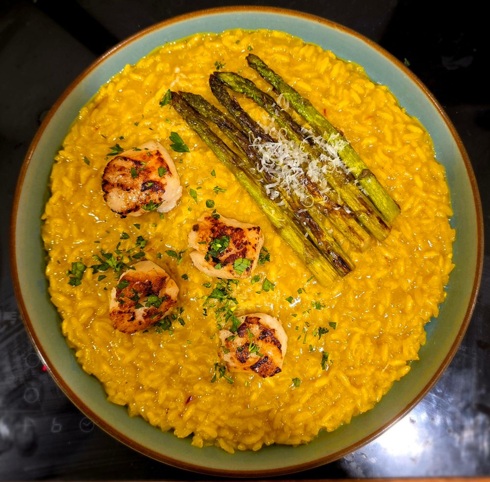 Risotto, studded wth four scallops and asparagus.