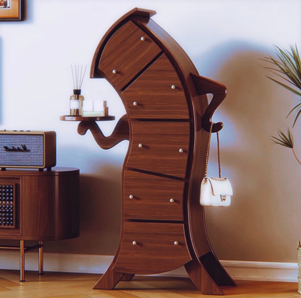 This dresser is a whimsical, surrealist piece of furniture designed to look anthropomorphic. The structure is curved and distorted, giving it a playful, animated effect, as though it's looking at a person inquisitively with a hand on its dresser hip. 

Key features include:
	•	Dark wood finish with a smooth, polished surface.
	•	Curved drawers that follow the wavy shape of the frame, each fitted with small, round knobs.
	•	“Arms” extending from the sides, one of which holds a small round tray, adding a functional touch.
	•	A hook-like extension on the right side, currently holding a small white handbag.
	•	A tilted top surface, complementing the exaggerated, fluid form of the entire dresser