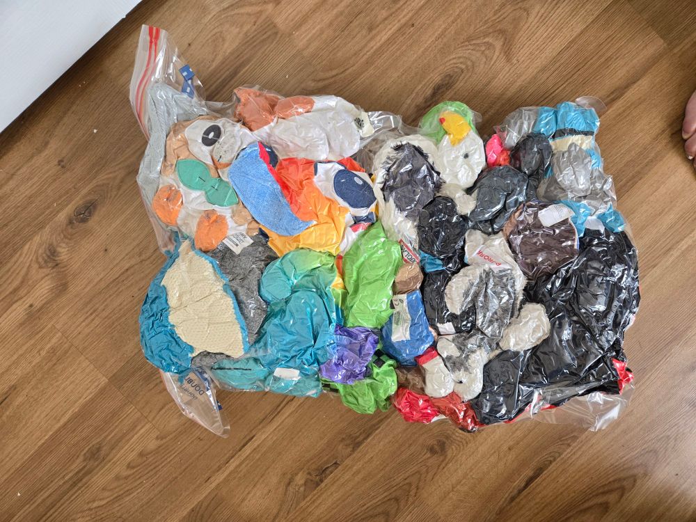 A bunch of plushies squished into a vacuum seal bag