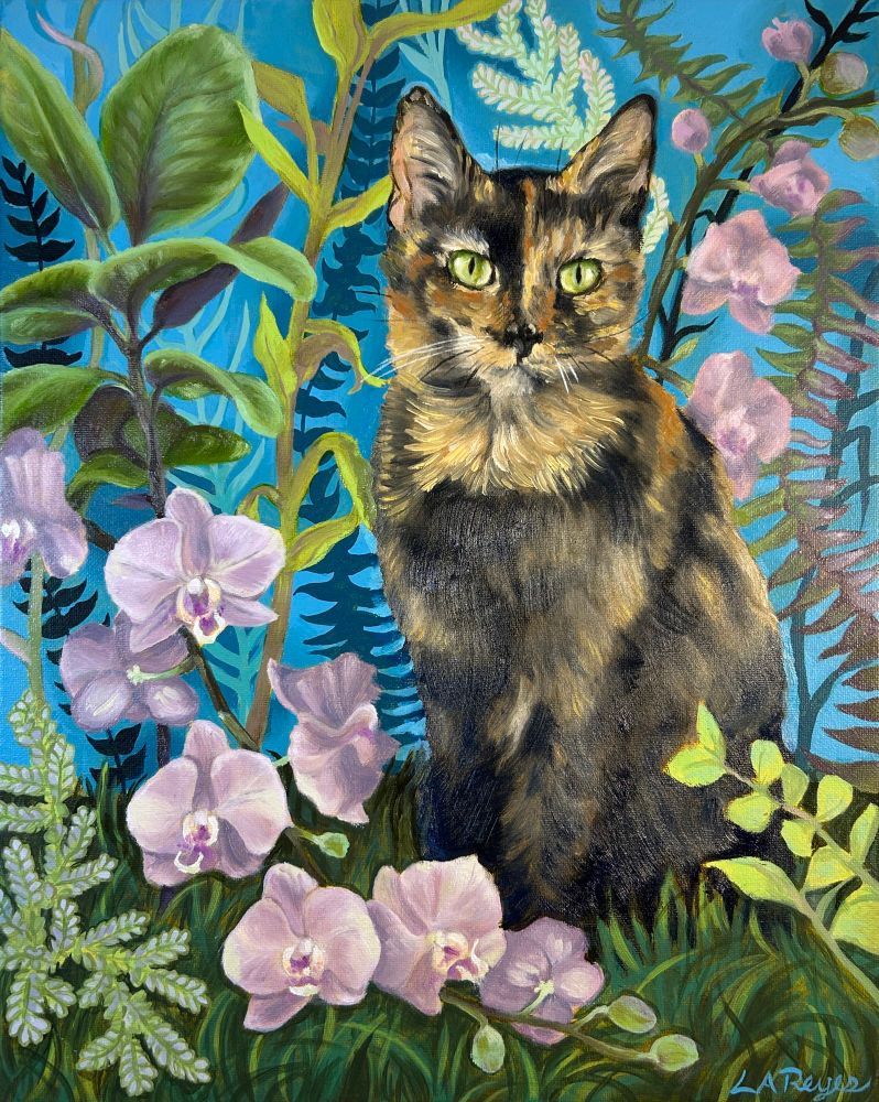 Tortie cat sitting among plants and flowers