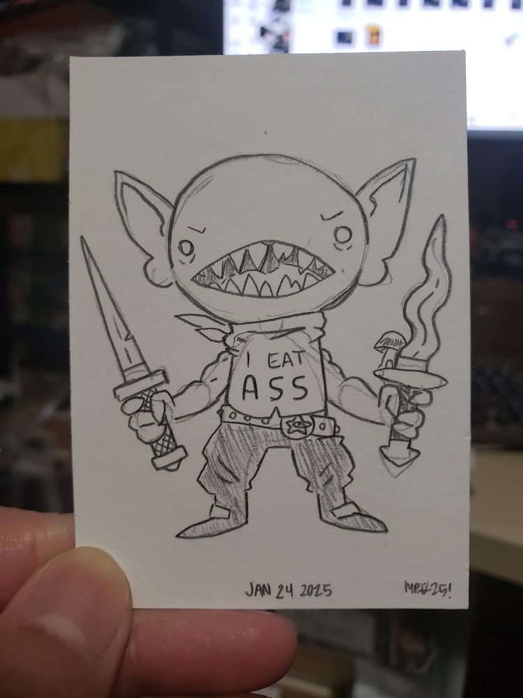 A goblin holding two knives. They're wearing a big that says "I eat ass"