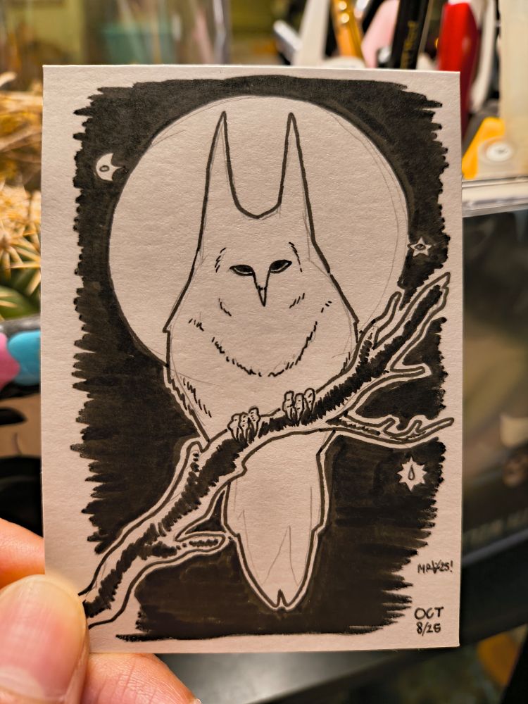 An owl with pronounced feather horns is framed by the moon