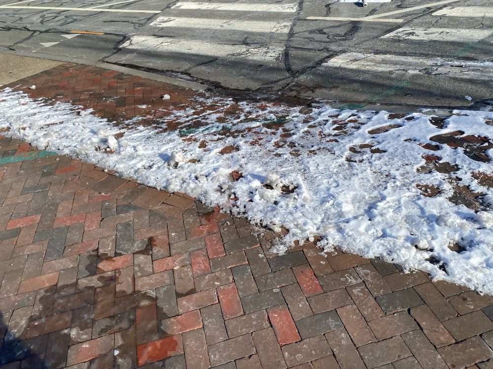 Curb cuts were left covered in ice after storms last winter. South Water St., Providence RI