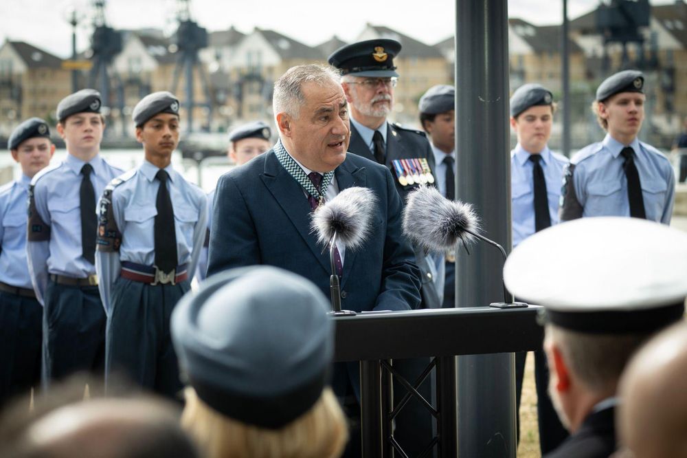 Man at podium in front of cadets 