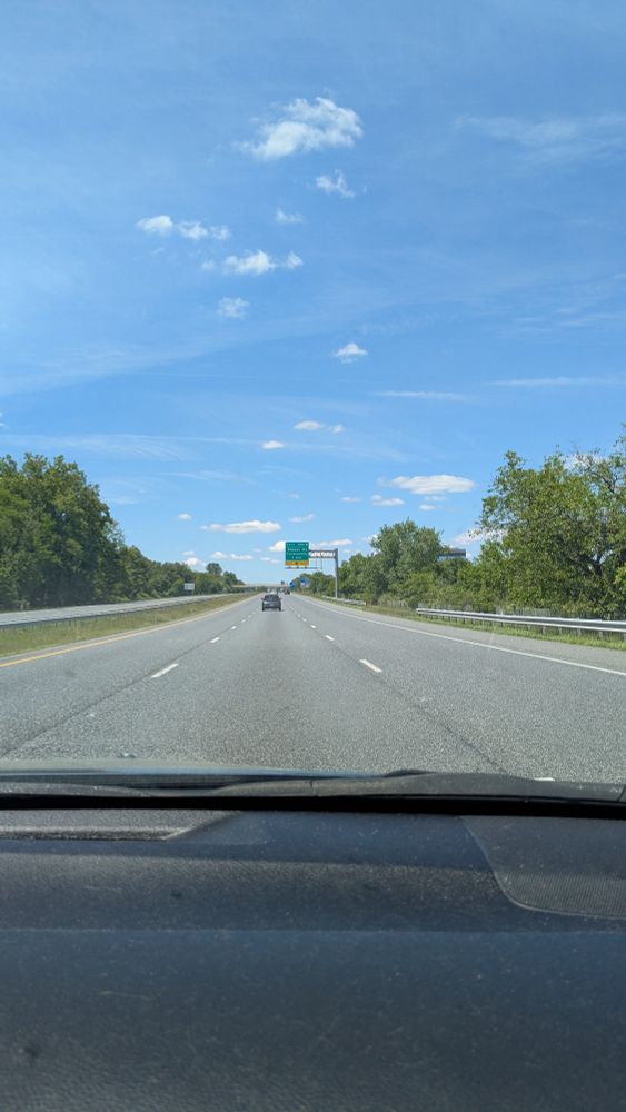 Blue sky and white clouds above interstate 83