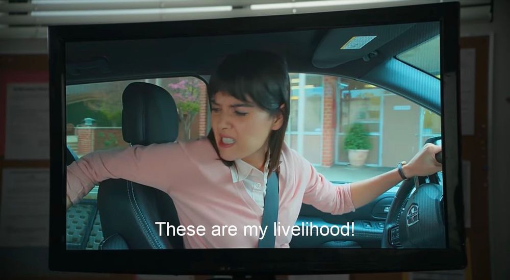Patti Harrison in the ITYSL “Tables” sketch, saying “these are my livelihood” as she looks into the back of her van