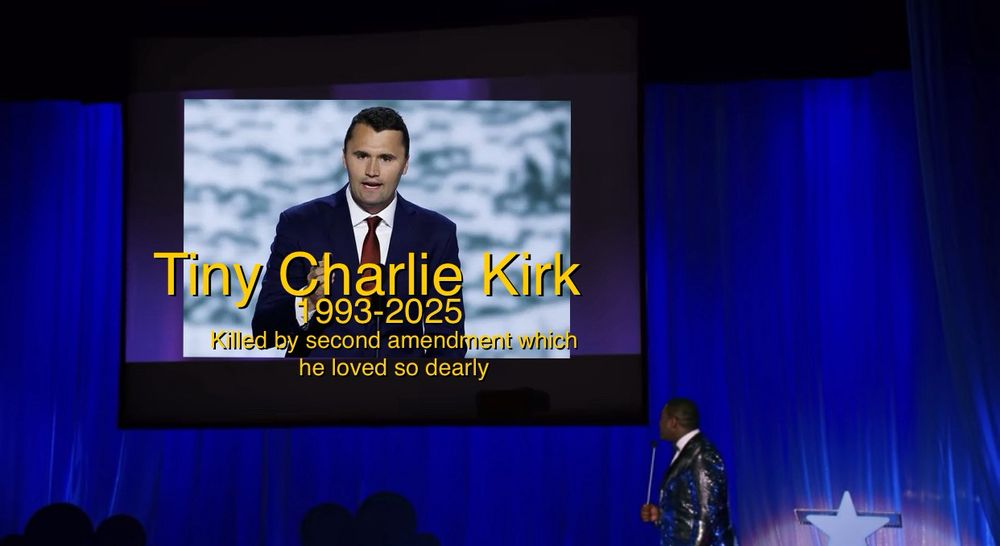 The “in memoriam” segment from the ITYSL “baby of the year” sketch. A photo of Charlie Kirk is on the screen, with the words “Tiny Charlie Kirk 1993-2025 killed by second amendment which he loved so dearly”