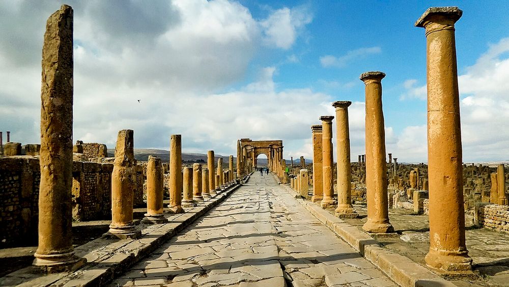 Different views of Timgad, with close ups of the latrines, the theatre and a colonnade