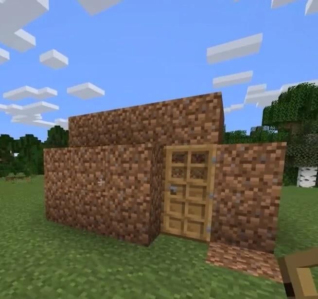 screenshot of a Minecraft dirt hut
