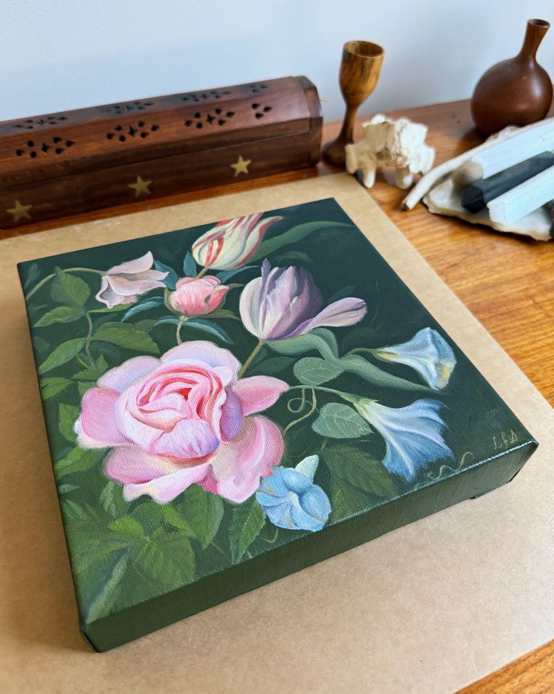 A birthday gift. A small oil painting with a dark green background, a pink rose, two tulips and some morning glory flowers. 