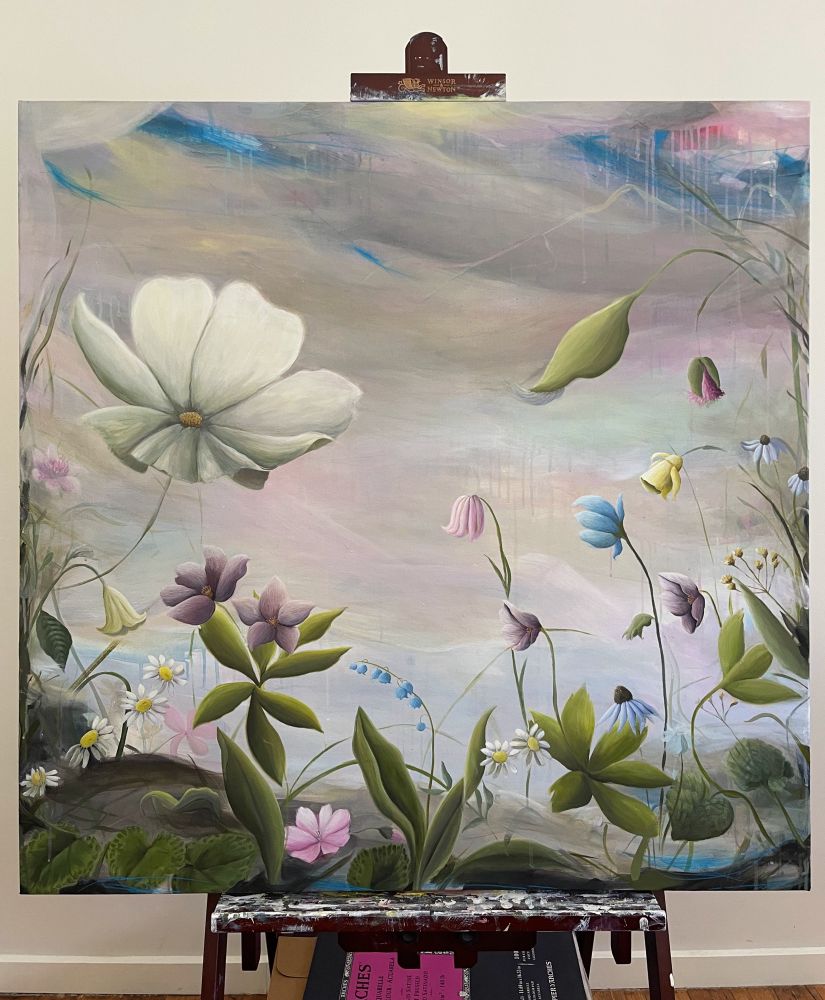 An acrylic floral and abstract landscape painting on an easel.