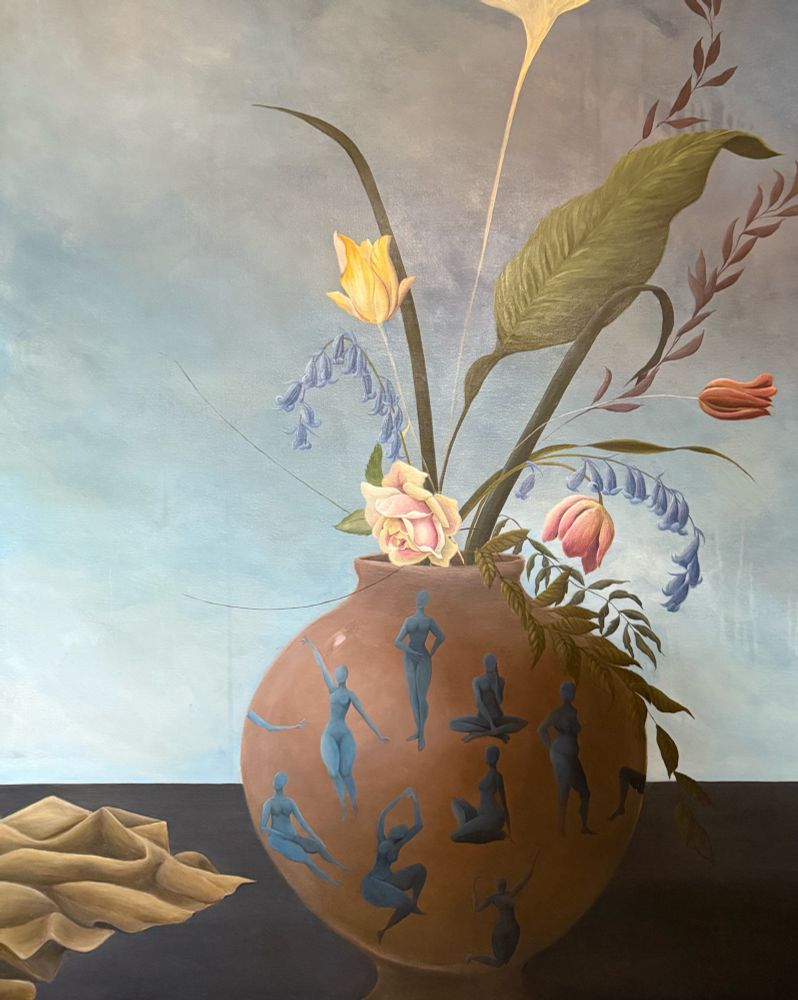An unfinished, acrylic floral painting with figures on a large pot and fabric in the foreground. 