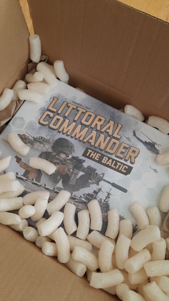 A copy of Littoral Commander - The Baltic among some packing peanuts.
