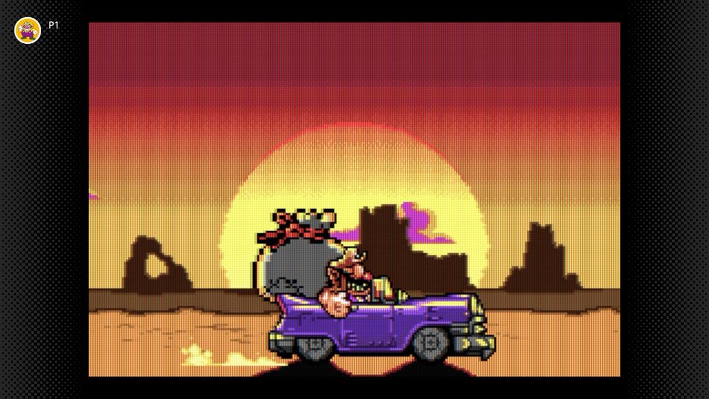 A screen shot of Wario Land 4, showing Wario driving a purple car through the desert at sunset. 