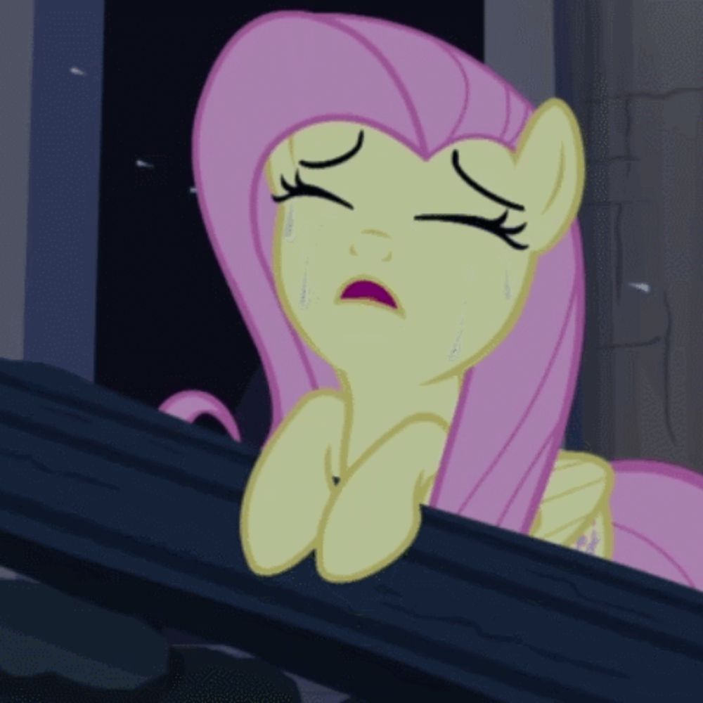 a cartoon pony with pink hair is crying