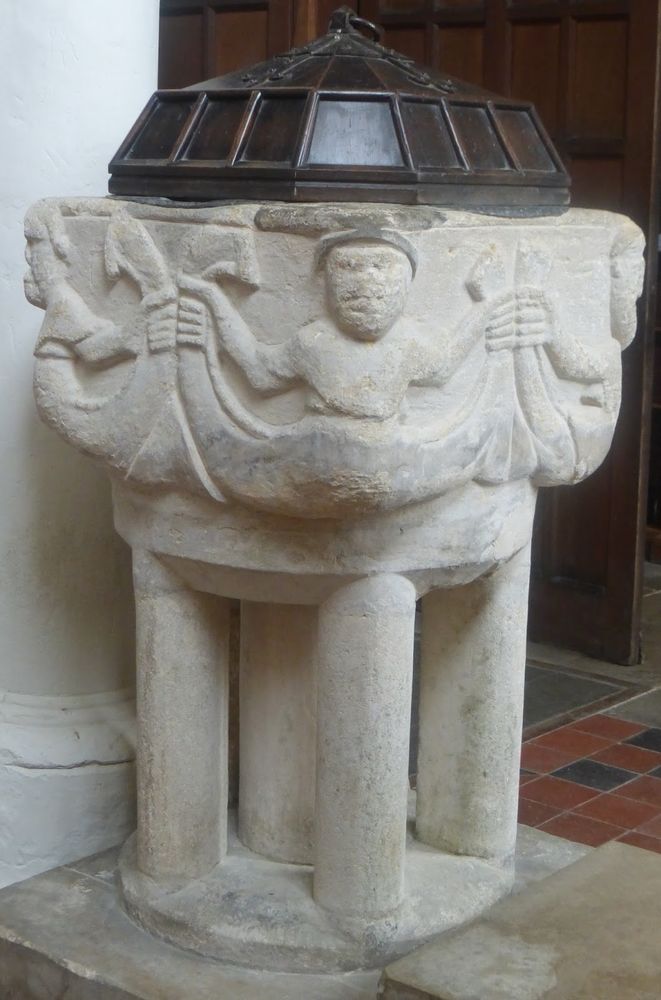 Font of mermen in St Peter’s 