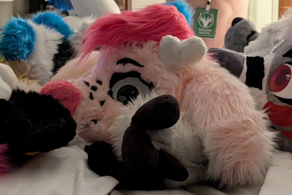 Pink deer fursuit head with magenta hair and large ears