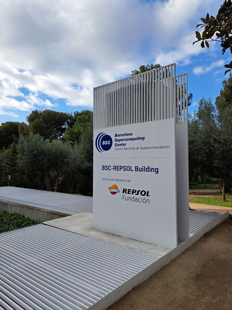 Picuture of organization name at the entrance of the building of the Barcelona Supercomputing Center 