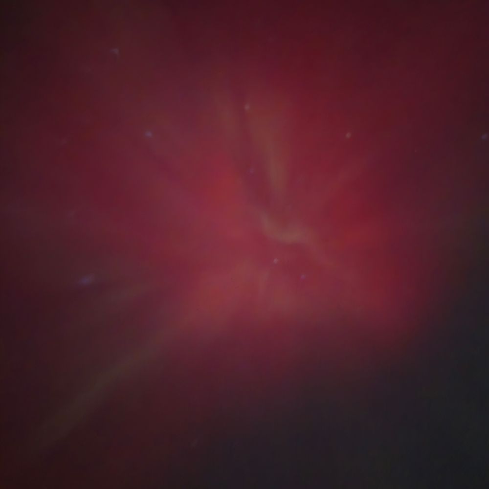 Aurora borealis directly overhead which appears as a psychedelic explosion of red. 11/11/25 near St. Paul, MN.