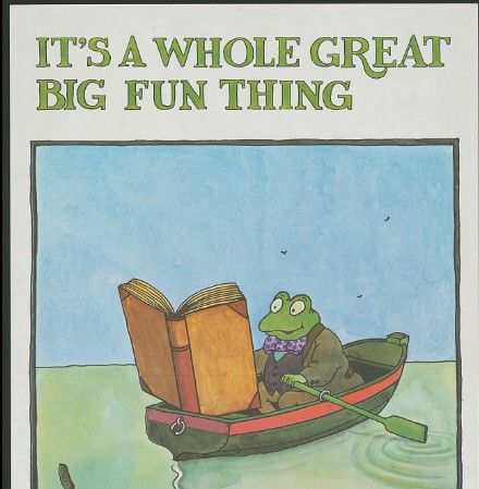 Frog in a boat reading a book. At the top of the picture it says, "It's a whole great big fun thing."