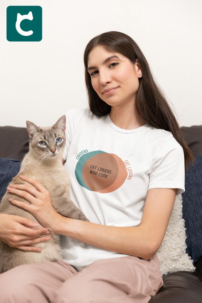 Smiling woman holding cat and wearing white t-shirt with teal and orange venn diagram. The outer sections say Coders and Cat Lovers. The larger intersection in the middle says Cat Lovers Who Code.