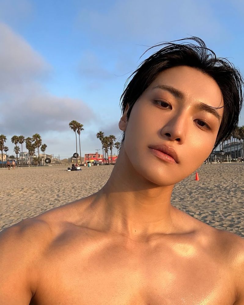 kpop group ateez member park seonghwa in a shirtless selfie