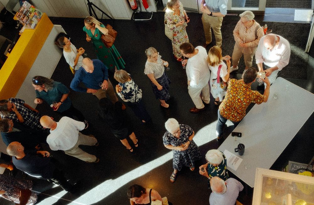 aerial of people milling at a party