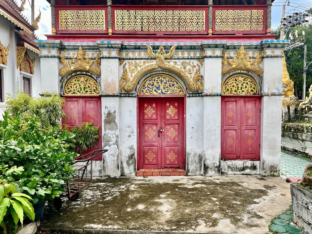 Ornate, old doors of a temple building 