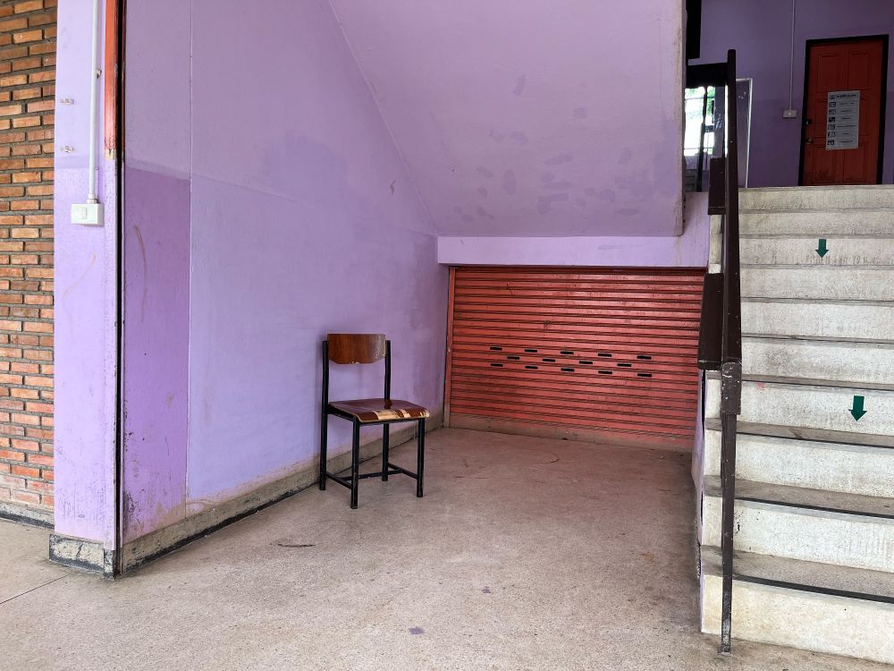 A lonely chair in a blue corner space