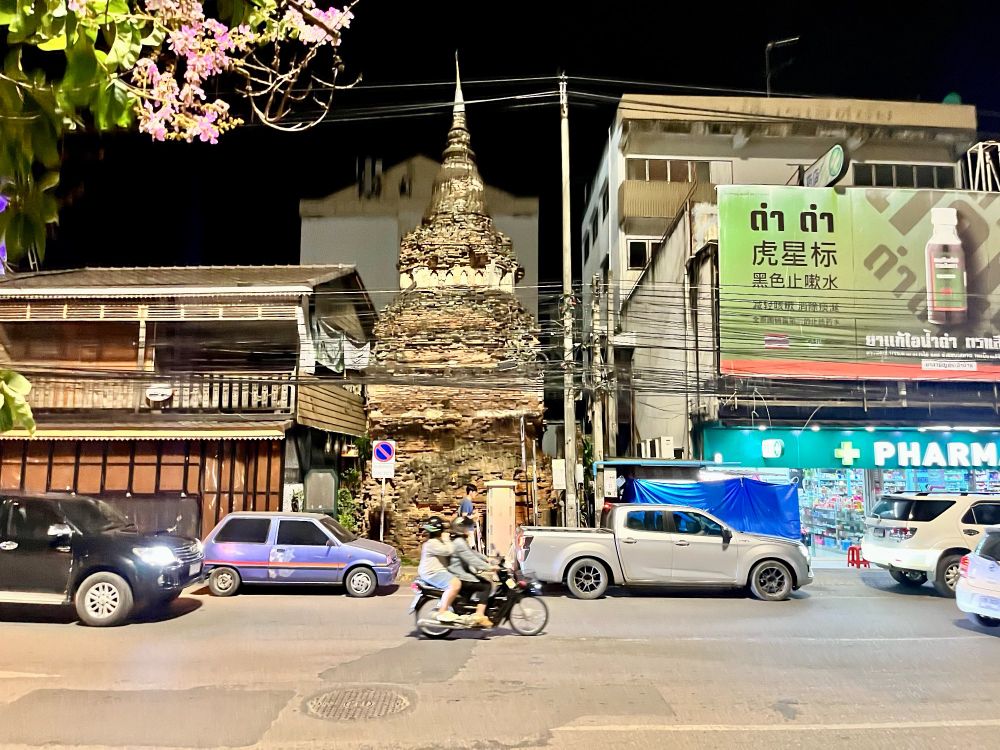 An old pagoda between modern buildings