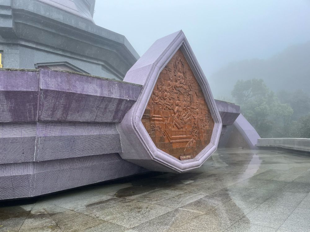 An architectural detail of a pagoda in the mist