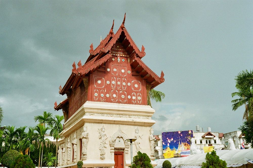 A temple building with storm clouds in the background 
