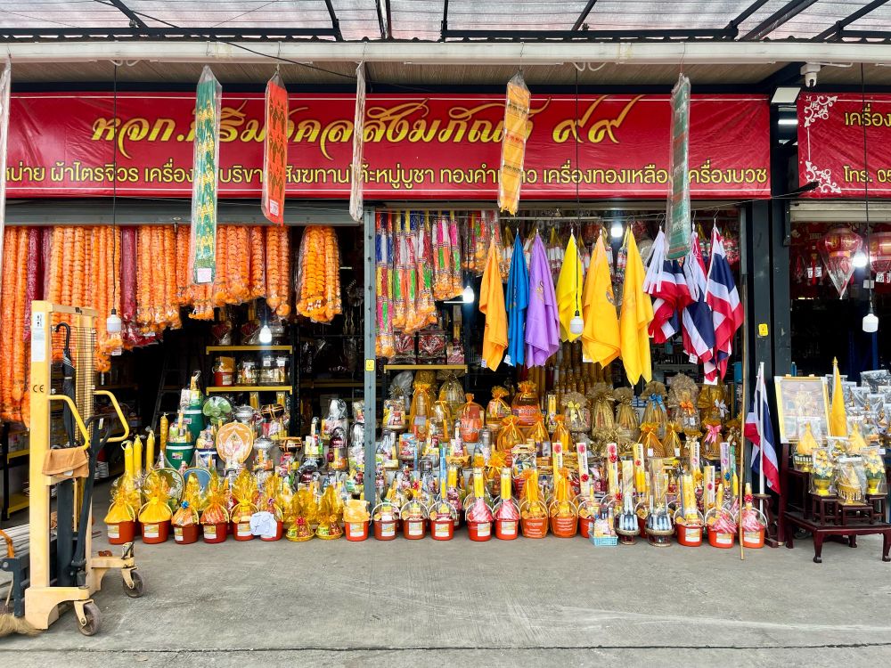 An arrangement of candles and decorations in a shop on the street 