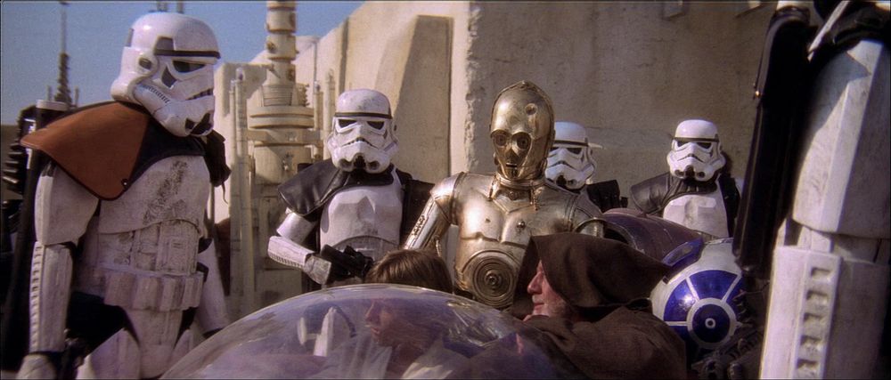 Fugitive resistance Jedi Ben Kenobi uses the force to deceive Stormtroopers on the way into Mos Eisley with Luke Skywalker and the droids in Star Wars: A New Hope