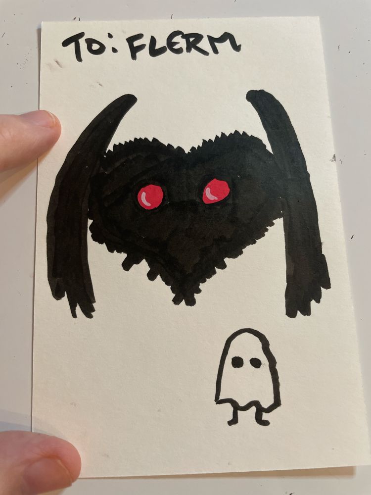 A black heart dressed as The Mothman. also a small ghost.