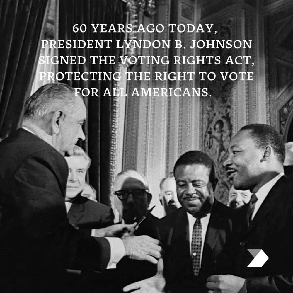 Photo of President Lyndon B. Johnson and Martin Luther King Jr. shaking hands after the signing of the Voting Rights Act of 1965.