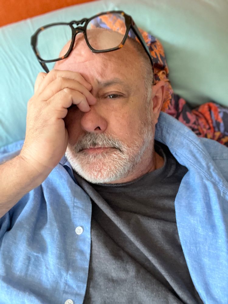 Exhausted gay with back pain 